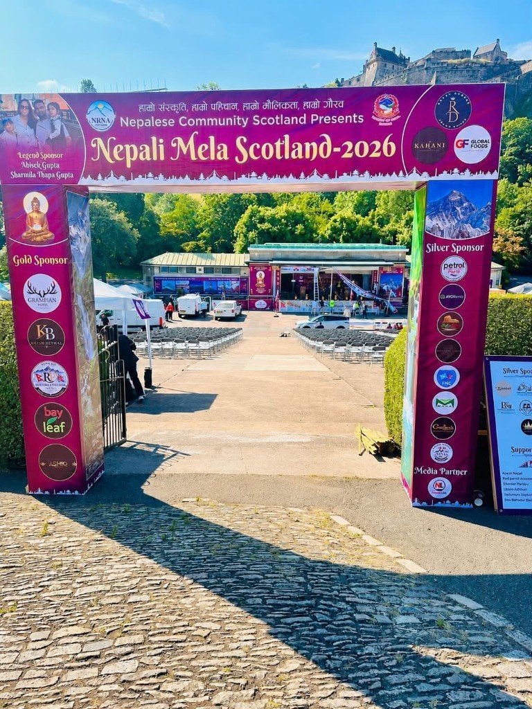 Nepali Mela Scotland 2026 entrance gateway at Princes Street Gardens with Edinburgh Castle